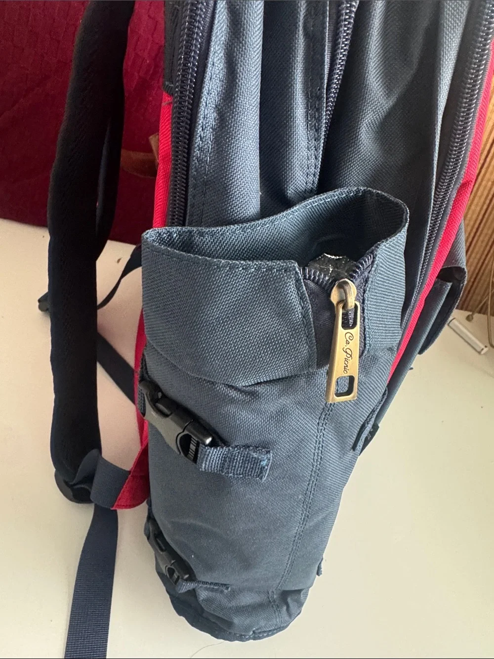 Navy and Red Canvas Backpack with Brown Trim